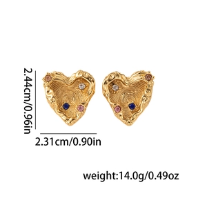 Macro detail of gold lava-textured heart earrings with colorful inset zircons