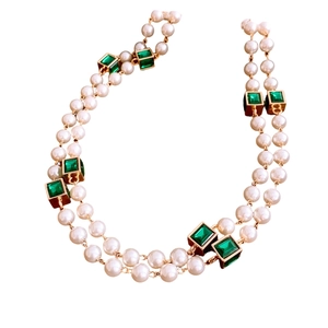 Elegant double-layered gold chain necklace with white pearls and green square gemstone