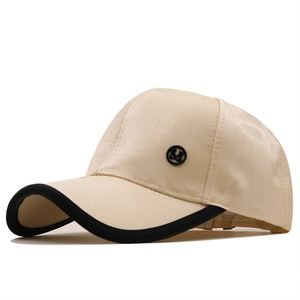 Cream satin baseball cap with black piping and M metal logo on a clean white background