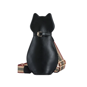 Close-up of black cat-shaped crossbody bag with glossy finish and striped strap