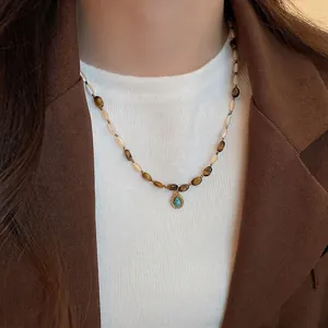 Tiger eye beaded necklace with turquoise teardrop pendant in vintage ethnic style
