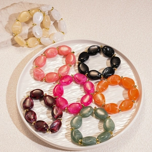 Colorful acrylic irregular oval beaded bracelets with golden metal spacers in assorted colors