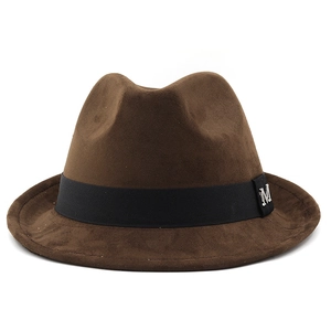 Detail of dark brown fedora with black ribbed band and silver metal M letter logo