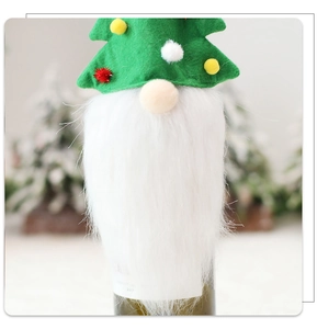Close-up of green felt gnome wine bottle topper with white beard for Christmas table decor