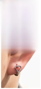 Detail showing twist vine earring size 1.26cm and heart hoop earring on earlobe