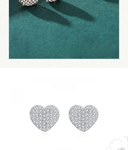 Close-up of S925 sterling silver heart stud earrings with white zircon micro-pave setting