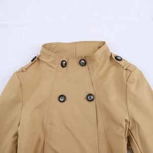Classic khaki double-breasted trench coat with shoulder epaulettes and lapel collar details