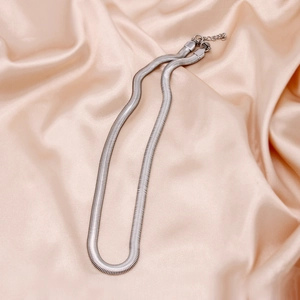 Close-up of 6mm silver flat snake chain necklace with lobster clasp on satin background
