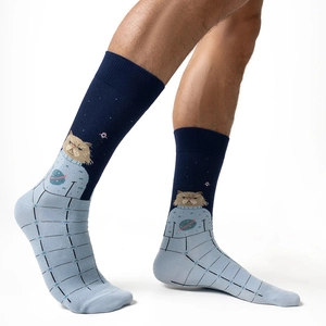 Close-up of crew socks featuring a space cat jacquard pattern in dark blue and light blue colors
