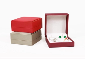 Detailed view of luxury brushed faux leather jewelry boxes for rings and necklaces