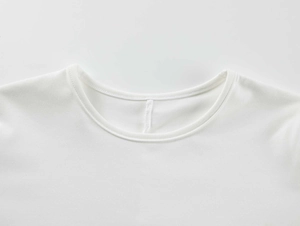 Detail of the crew neckline with double-needle stitching on white stretch athletic tee