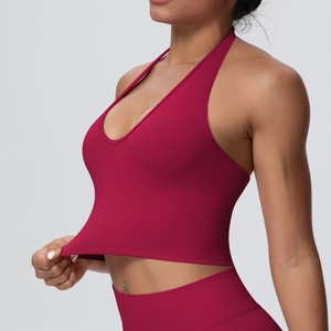Detail showing the high elasticity and ribbed knit texture of this red sports bra