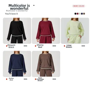 Detail view of colorful long-sleeved sweatshirts in black, red, green, blue, and brown