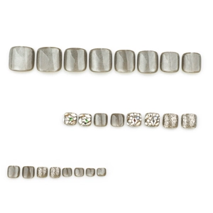 Grey cat eye press-on toenails set with silver glitter and rhinestone accents