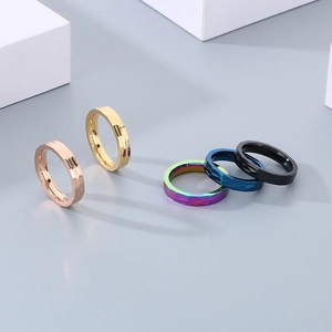 Textured multi-color stainless steel rings with geometric facets and minimalist wide band