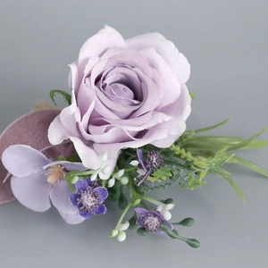 Artificial purple rose boutonniere with green leaves and white berries for weddings