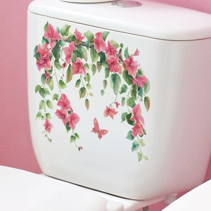 Watercolor pink flowers and green leaves self-adhesive decal on white toilet tank