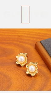 Detail of 18k gold plated irregular wavy studs with 8-10mm natural freshwater pearl