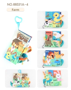 Detail of Happy Farm baby cloth book showing 3D animal tails and hanging heart hook
