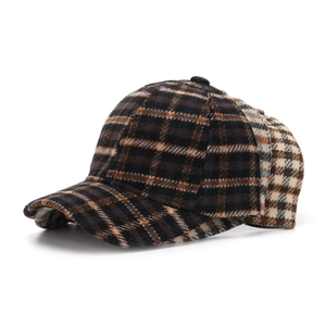 Detail showing various plaid patterns and thick wool texture on classic baseball caps
