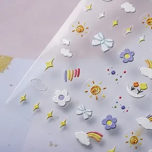 3D embossed nail stickers featuring sun and rainbow motifs in soft pastel macaron colors