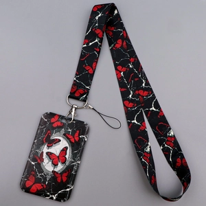 Detail of black and red butterfly lanyard with card holder featuring marble pattern textures