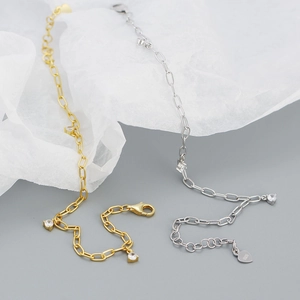 Detail view of S925 sterling silver bracelet showing zircon charms and lobster clasp