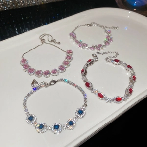 Sparkling zircon bracelet set with heart, oval and square pendants on silver chain