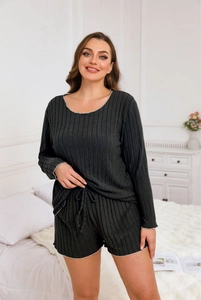 Detail of dark grey-green ribbed knit loungewear set with wavy edges and drawstring shorts