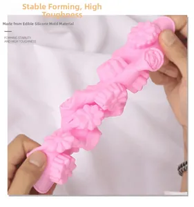 Close-up of flexible pink flower silicone mold showing high durability and elasticity