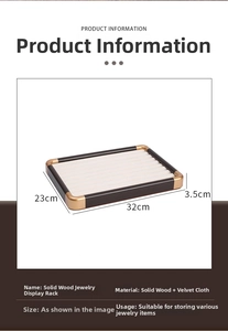 Macro detail of walnut wood jewelry display tray with velvet slots and metal corners