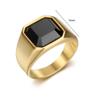Macro detail of 15mm gold-tone ring featuring a polished band and square black gemstone