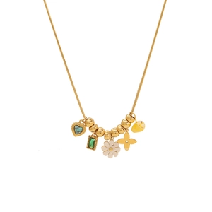 Gold snake chain necklace with floral, heart, and gemstone charms on a white background