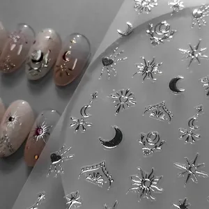 3D metallic silver nail stickers featuring celestial sun, moon, and heart relief patterns