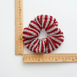 Red and silver glitter Christmas scrunchie with 10cm diameter measurement on white background