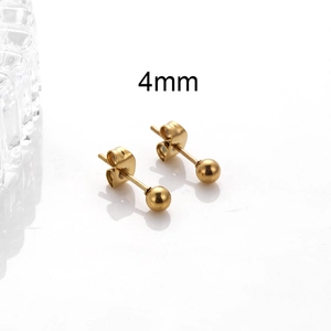 Macro shot of 4mm golden stainless steel ball earrings with secure metal backings