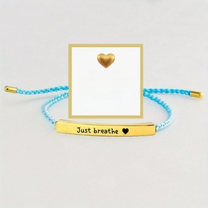 Blue woven bracelet with gold engraved Just Breathe plate and motivational quote card