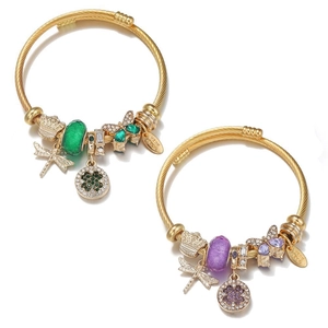 Golden spiral beaded bangles with dragonfly and four-leaf clover pendants