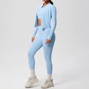 Three-piece light blue women's yoga set including hooded zip jacket, sports bra, and high-waist pants