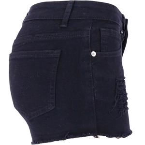Detail view of black denim shorts with ripped side cutouts and raw hem edge