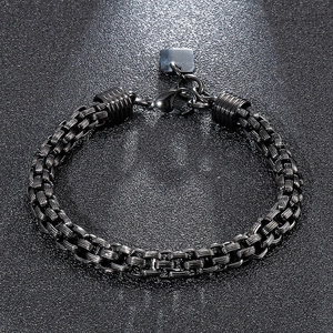 Macro detail of men black stainless steel box chain bracelet with lobster clasp