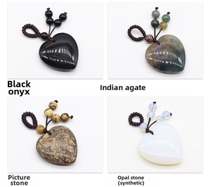 Detail view of heart shaped black onyx and indian agate woven gemstone pendants