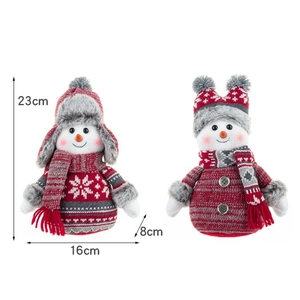 Detailed size view of two plush Christmas snowmen in red and grey knitted outfits