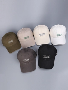 Macro view of six cotton baseball caps featuring vintage original design embroidery detail