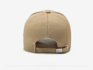 Detail of adjustable khaki baseball cap with twill fabric and metal buckle closure