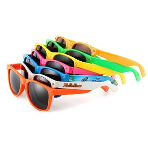Detail showing stacked colorful oversized cat-eye sunglasses with beach patterns on temples