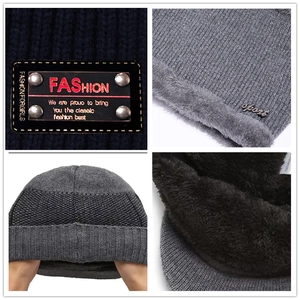 Detailed macro view of 100% acrylic knit fabric with thick black fleece lining for warmth