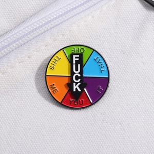 Rotating rainbow enamel pin with black arrow pointer and various humorous phrases