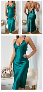 Detail view of dark green satin slip dress featuring V-neck and open back design