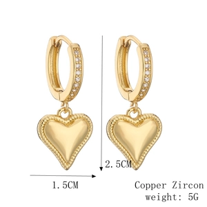 Detail view of gold heart drop earrings with dimensions 2.5cm height and copper zircon material